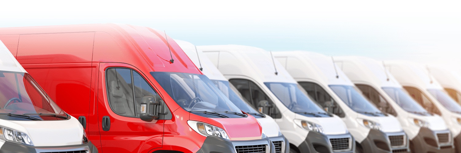 Row of M&C Logistics delivery vans